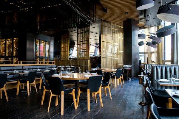 A restaurant dining room set for service